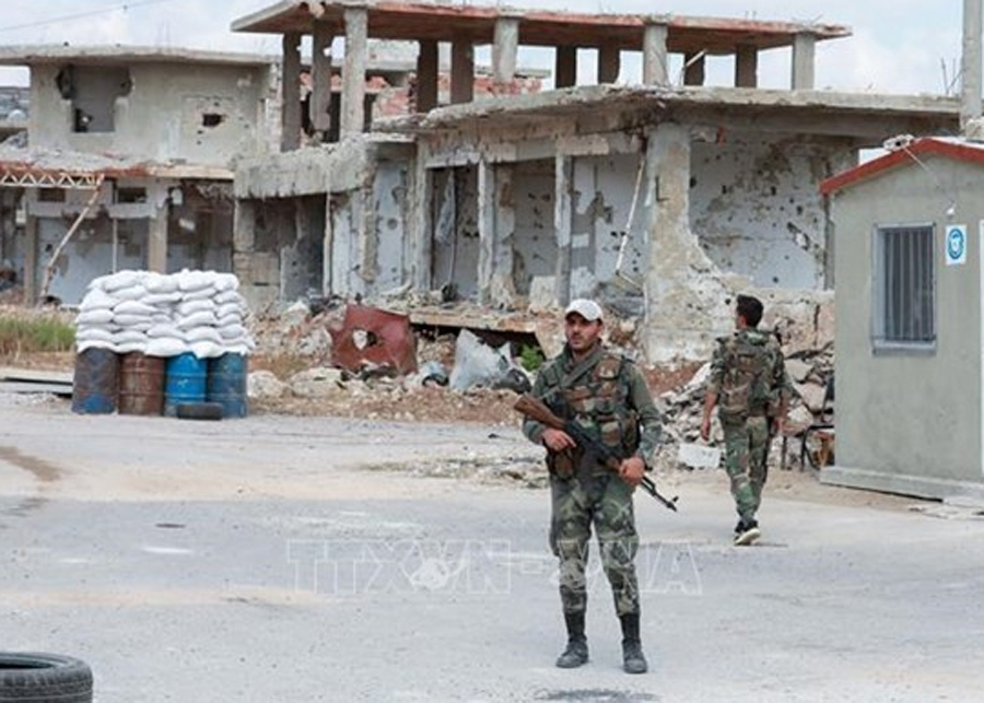 Binh sỹ Syria tại một điểm kiểm soát ở quận Daraa al-Balad, thành phố miền Tây Nam Daraa, ngày 12/9/2021. 
