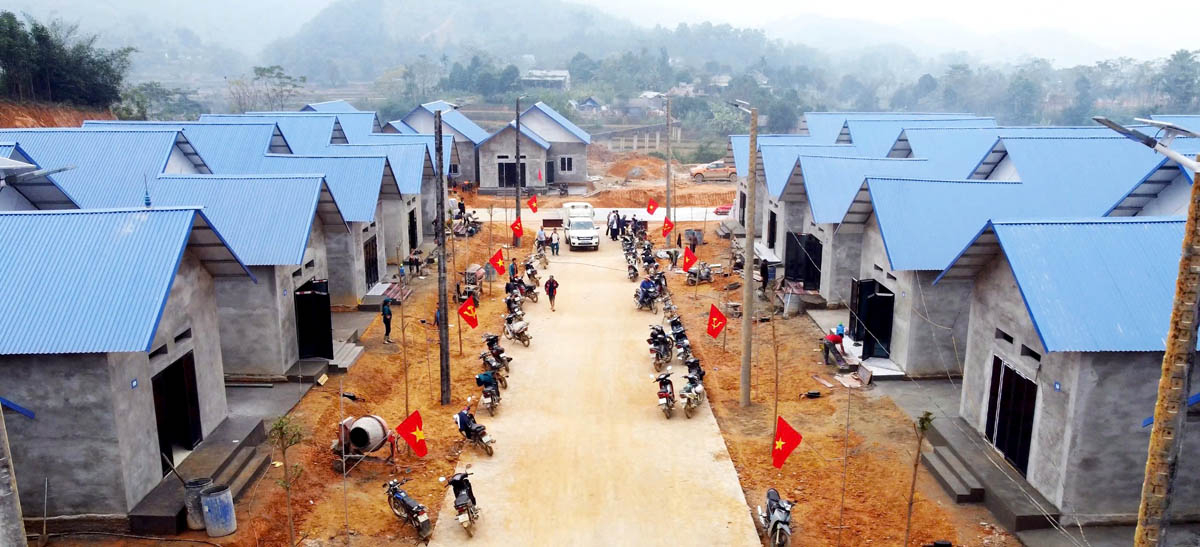 The houses in the Dong Tam resettlement area are painted blue to symbolise hope.