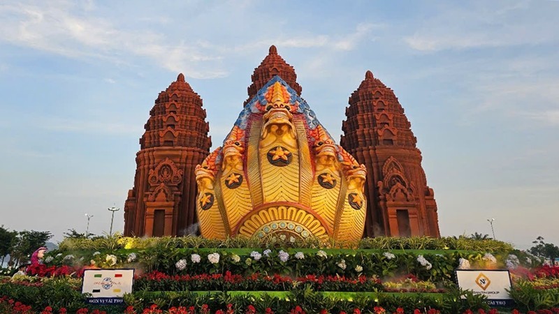 The five-head Naga installation in front of the Duong Long Champa tower.