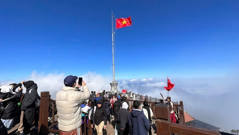 Tourists enjoy checking in at the roof of Indochina during the Lunar New Year.