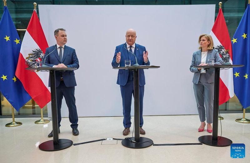 Leader of the Austrian Peoples Party Christian Stocker (C), Social Democratic Party Chairman Andreas Babler (L), and NEOS party leader Beate Meinl-Reisinger (R) attend a press conference in Vienna, Austria, on February 27, 2025.