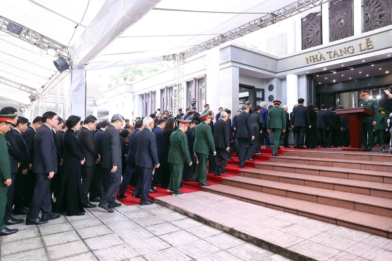 The delegation of the Central Committee of the Communist Party of Vietnam, led by Politburo member and President To Lam pay respects to General Secretary Nguyen Phu Trong at the National Funeral Hall, No.5 Tran Thanh Tong, Hanoi. 