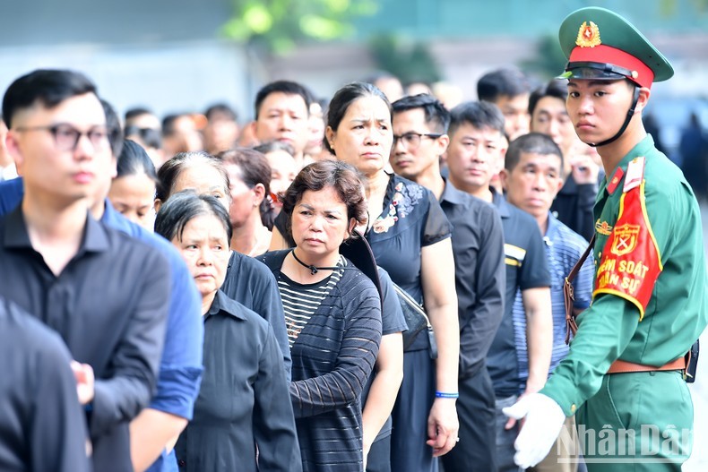 Inside the funeral home, personnel are present to assist people who come to pay respect to the Party leader.