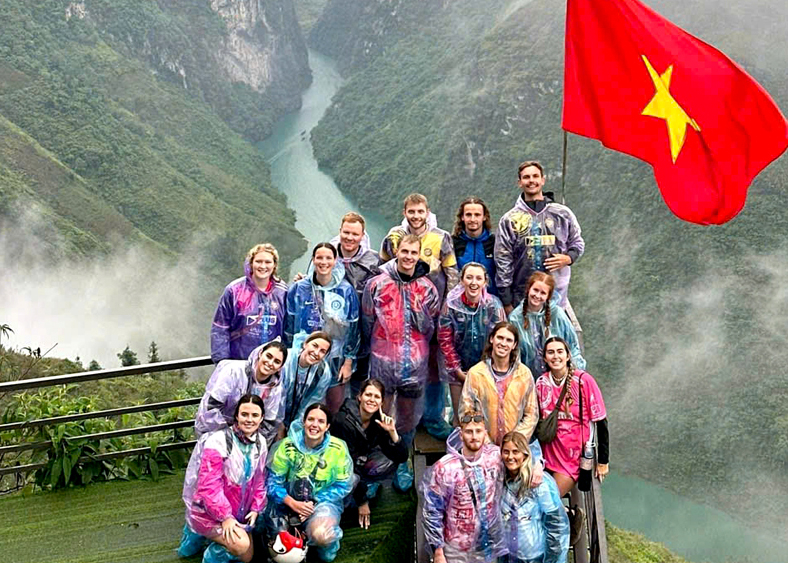 Dinh Thi Hai Yen, a tourist from Hanoi, takes a photo during her visit to Ha Giang City.