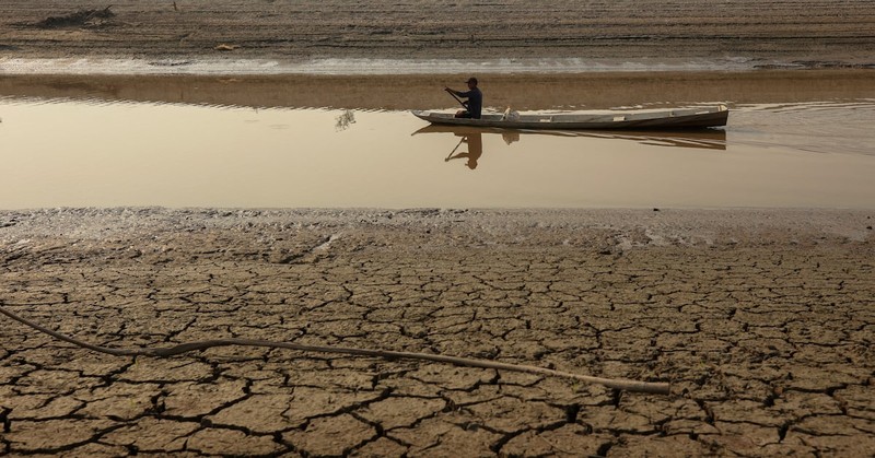 A person on a boat navigates on Puraquequara Lake, which has been affected by drought, in Manaus, Brazil, October 6, 2023.