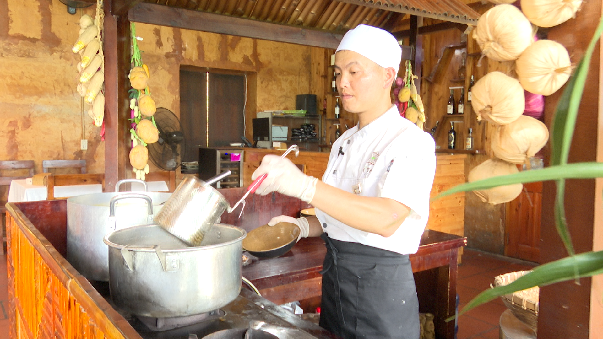 Pho Ngo noodles are placed in a bowl, topped with beef and spring onions, and finished with steaming hot beef broth to cook the meat and release the sweet corn flavour hidden in the noodles.