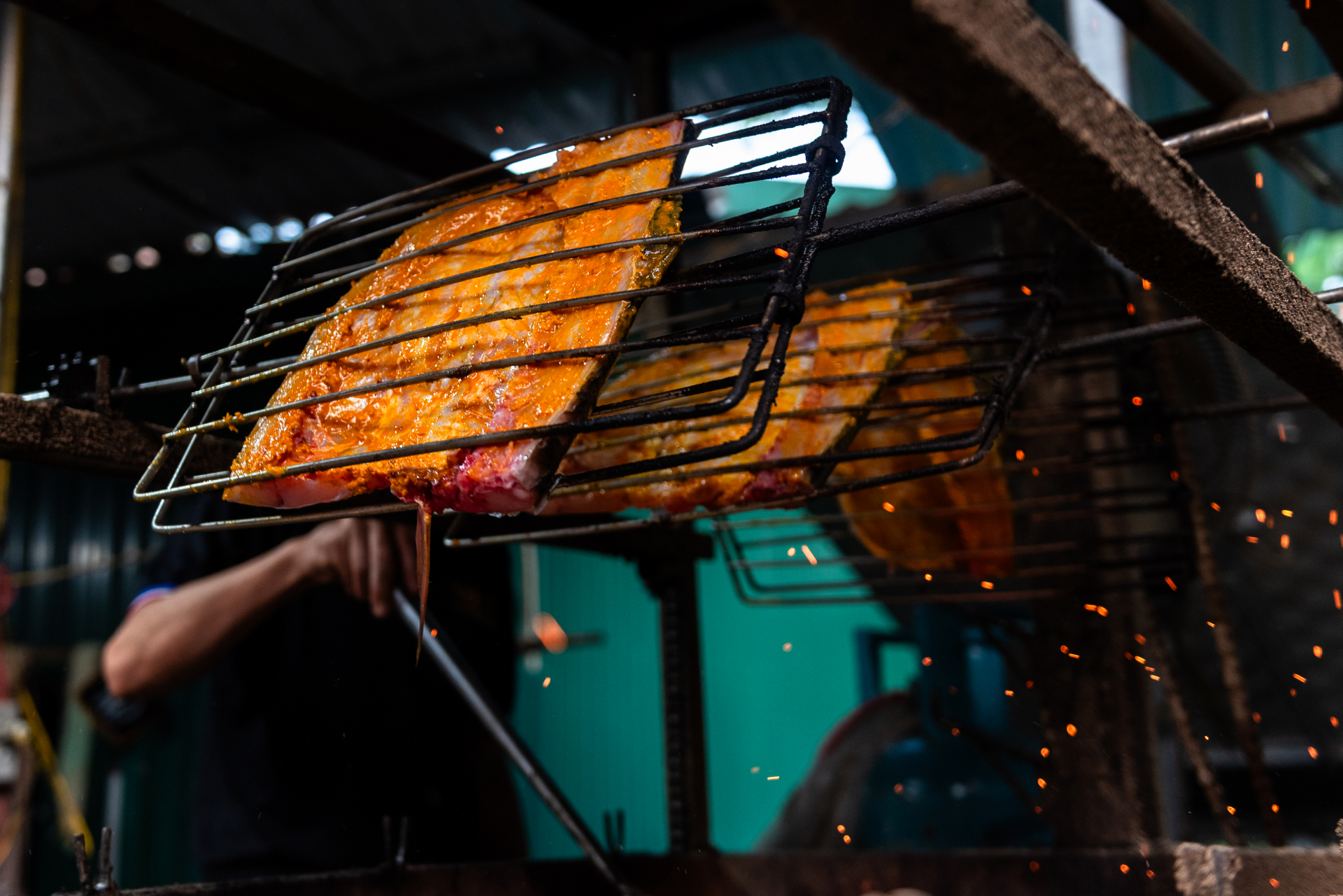 Grilled Bong fish is a rustic but delectable dish. The fish is cleaned, marinated with spices such as turmeric, galangal, and rice vinegar, and then grilled over hot coals.