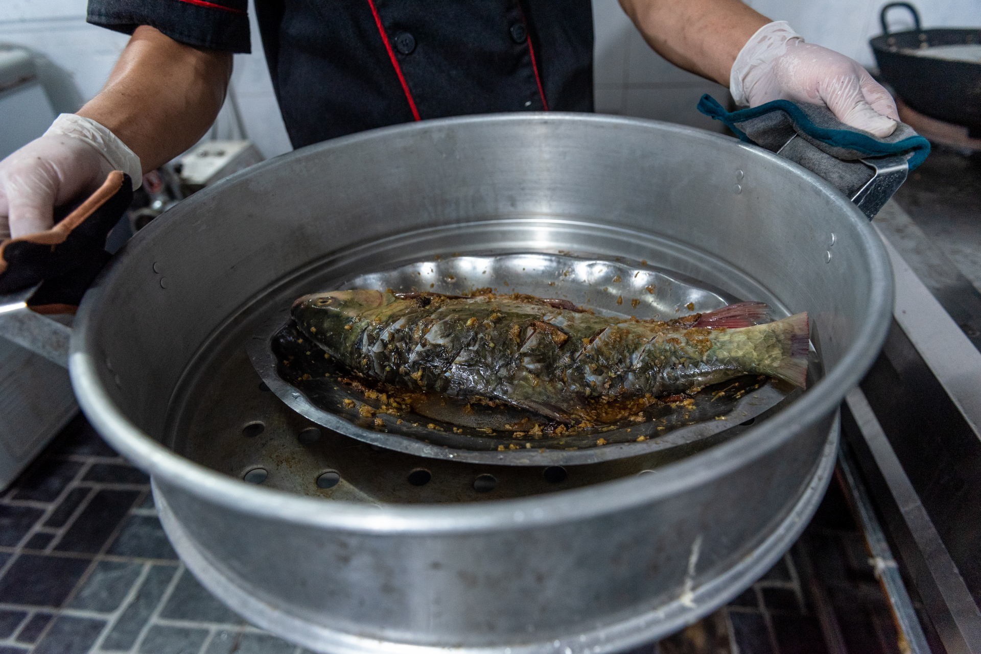 Steamed Bong fish is a dish that retains its natural flavour and nutritional value. The fish is cleaned and marinated with ginger, lemongrass, and onions before being steamed.