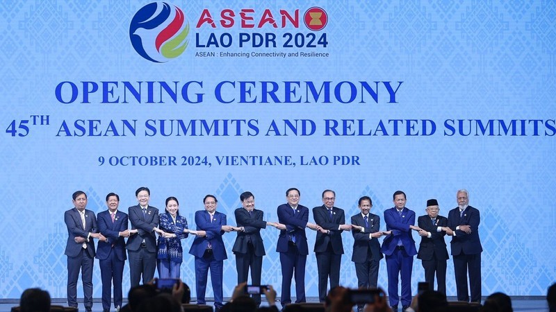 Vietnamese PM Pham Minh Chinh and other heads of delegations pose for a group photo at the ASEAN Summit in Vientiane on October 9. 