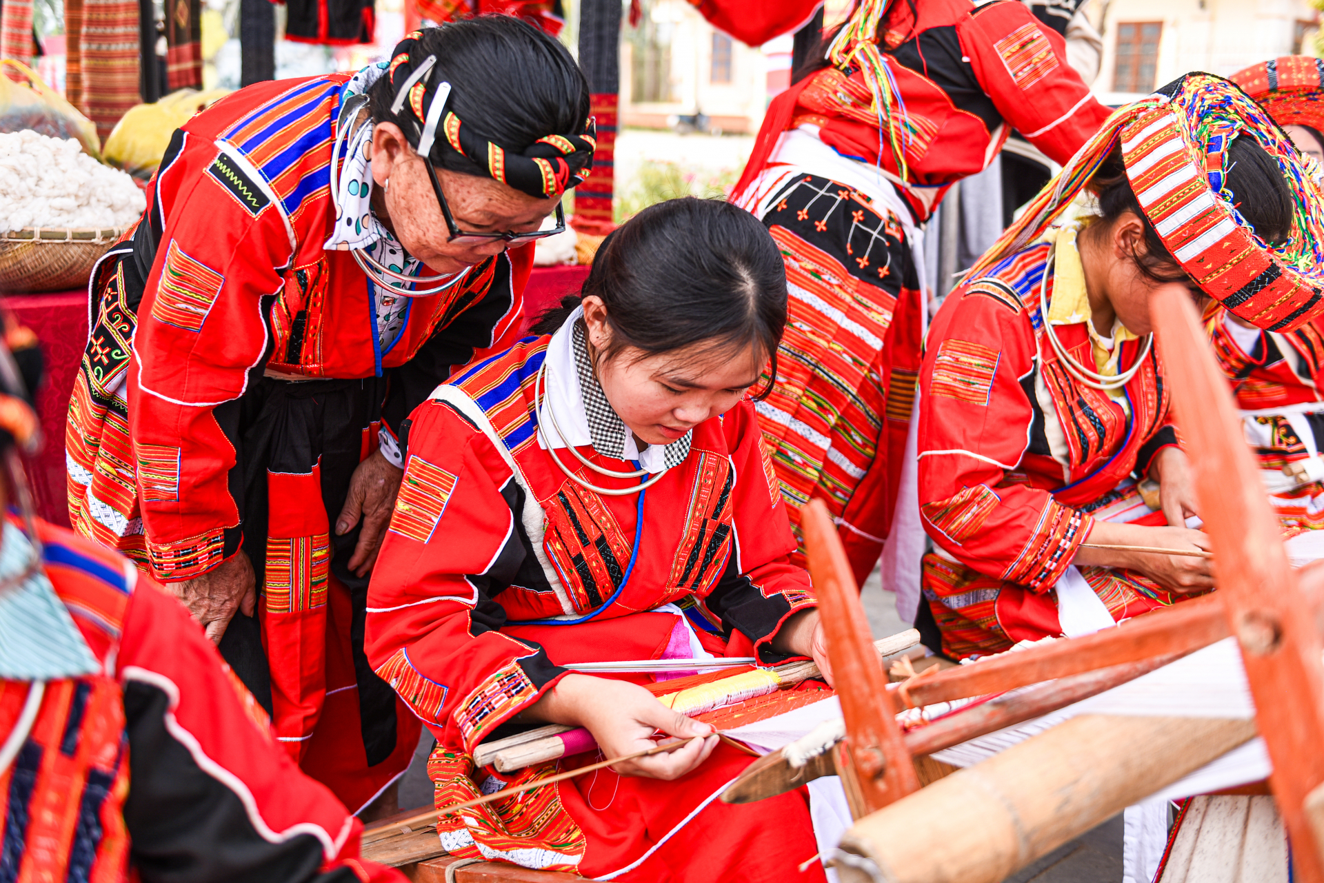 At cooperatives in their communities, young girls like Lan Thi No (16 years old) and Hoang Thi Khanh Thy (12 years old) are learning brocade weaving.