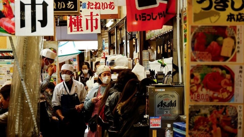 Employees of seafood restaurants work at Tsukiji Outer Market in Tokyo