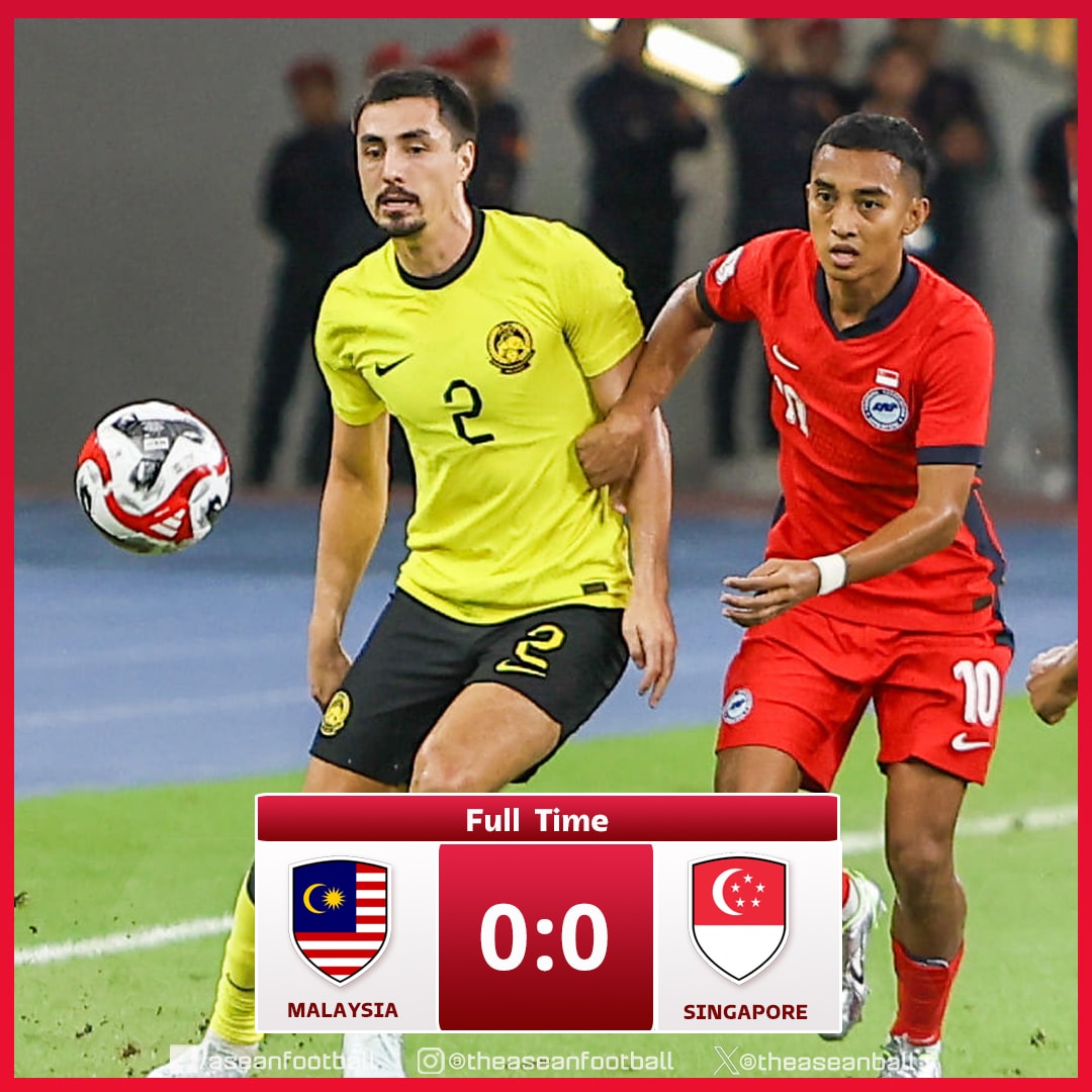 hủ hòa Malaysia (áo vàng) 0-0, Singapore giành vé thứ 2 vào bán kết ASEAN Cup 2024. 